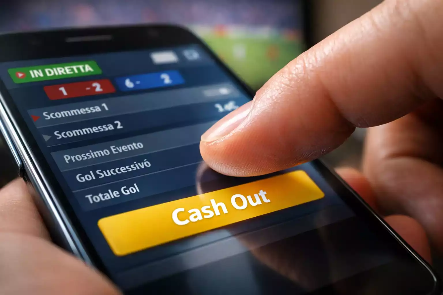 Mano che tocca pulsante su app di scommesse durante partita live